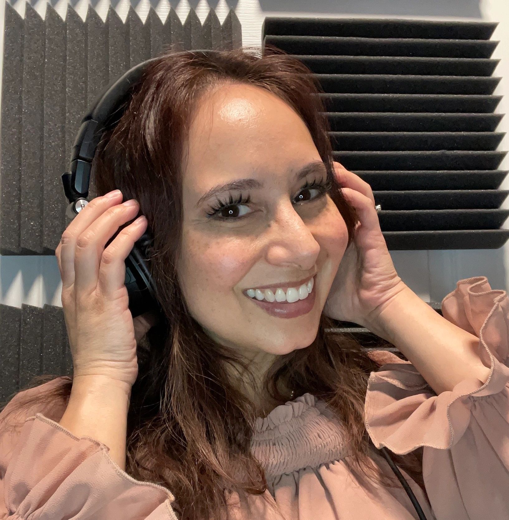 Tina James with headphones in recording studio