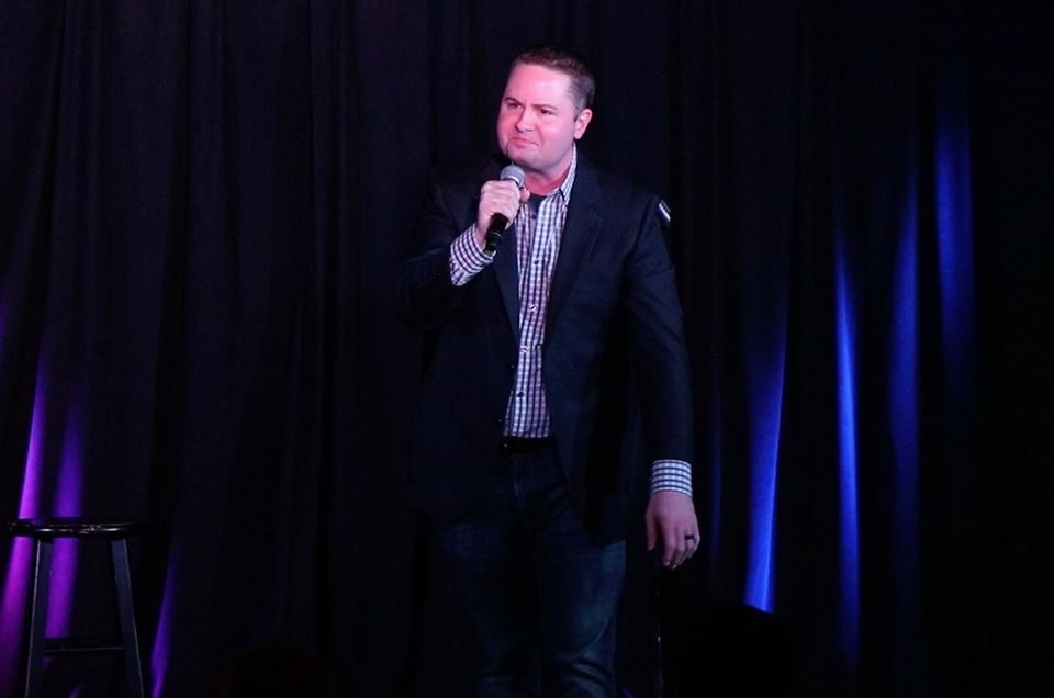 Brandon James performing on stage