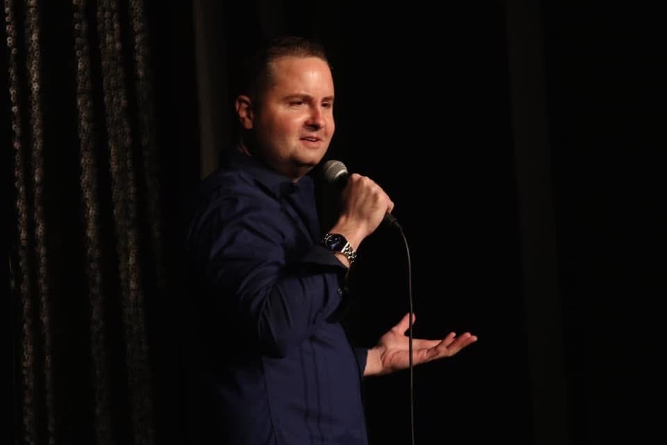 Brandon James performing on stage