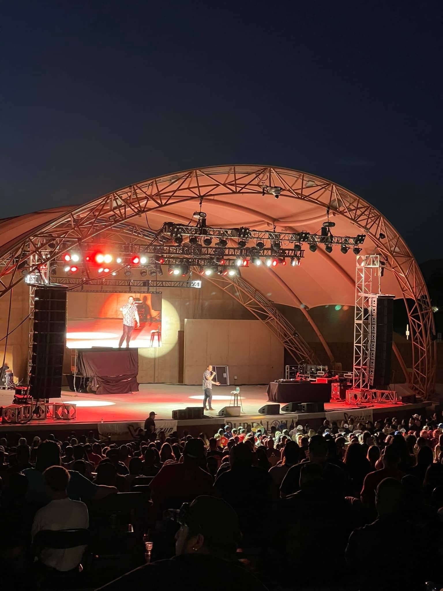 Brandon James performing at outdoor amphitheater